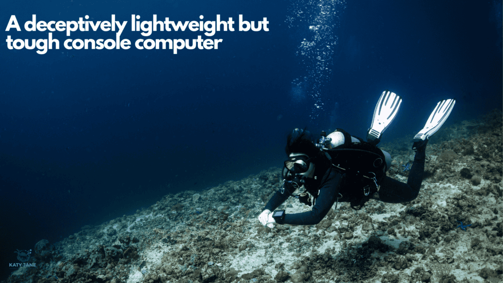 scuba diver floating over reef with dark blue water